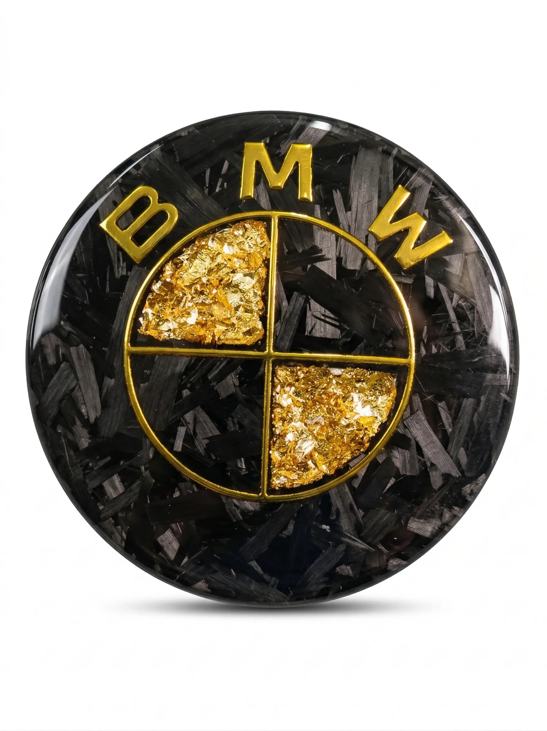 Forged carbon fiber and gold leaf custom roundel badge by REVMODE